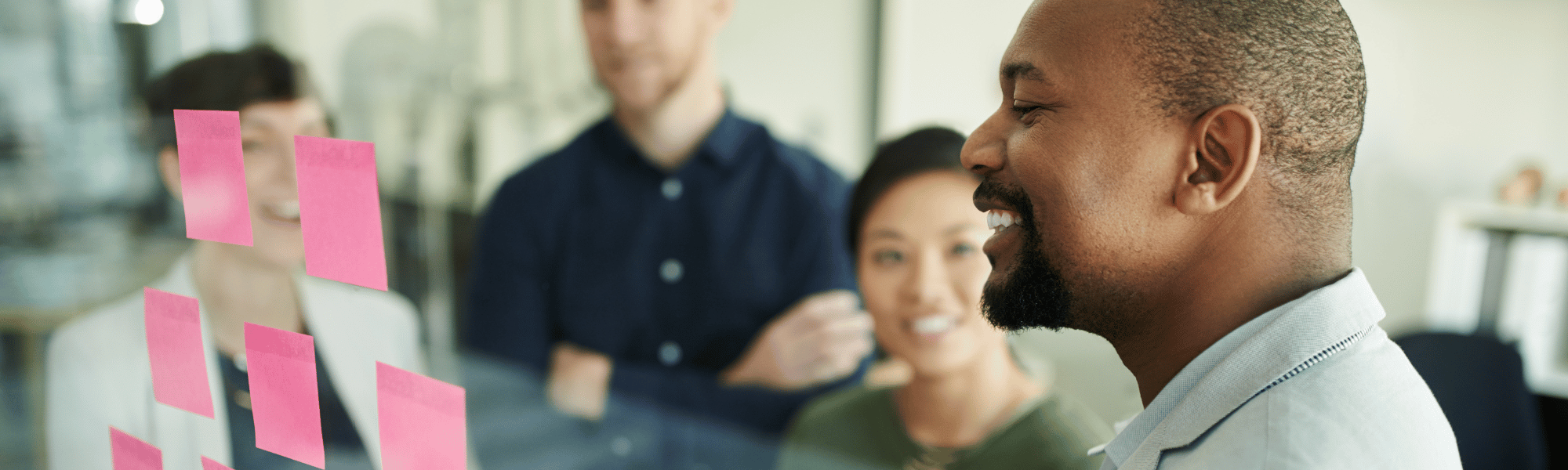 Team members collaborating effectively in a meeting, sharing ideas.