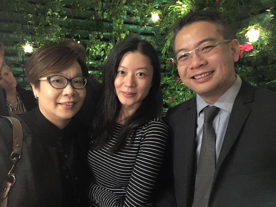 Networking photo of two women and a man