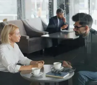 Two people working together at a table