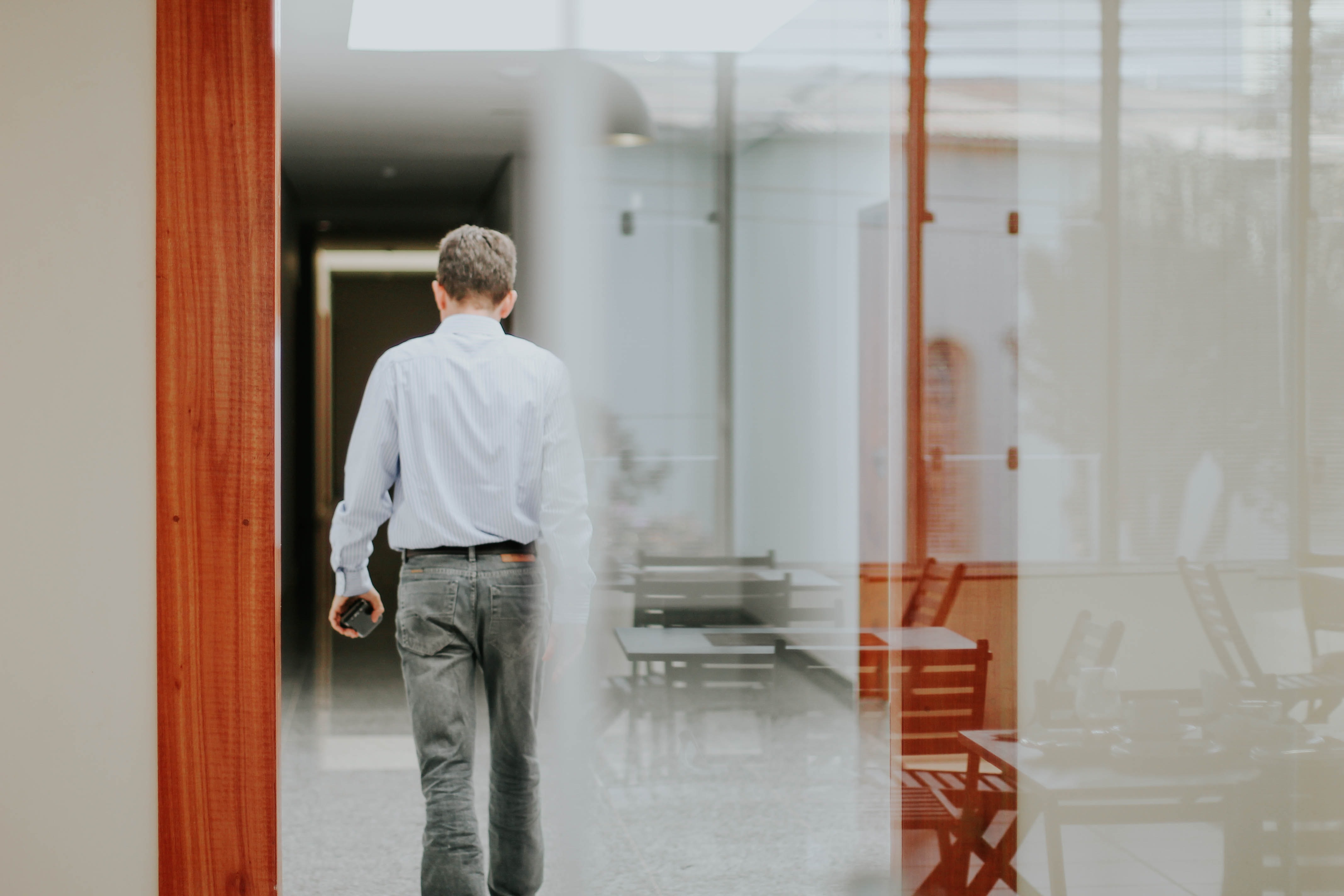 Man walking through a Finance and Accountancy Office