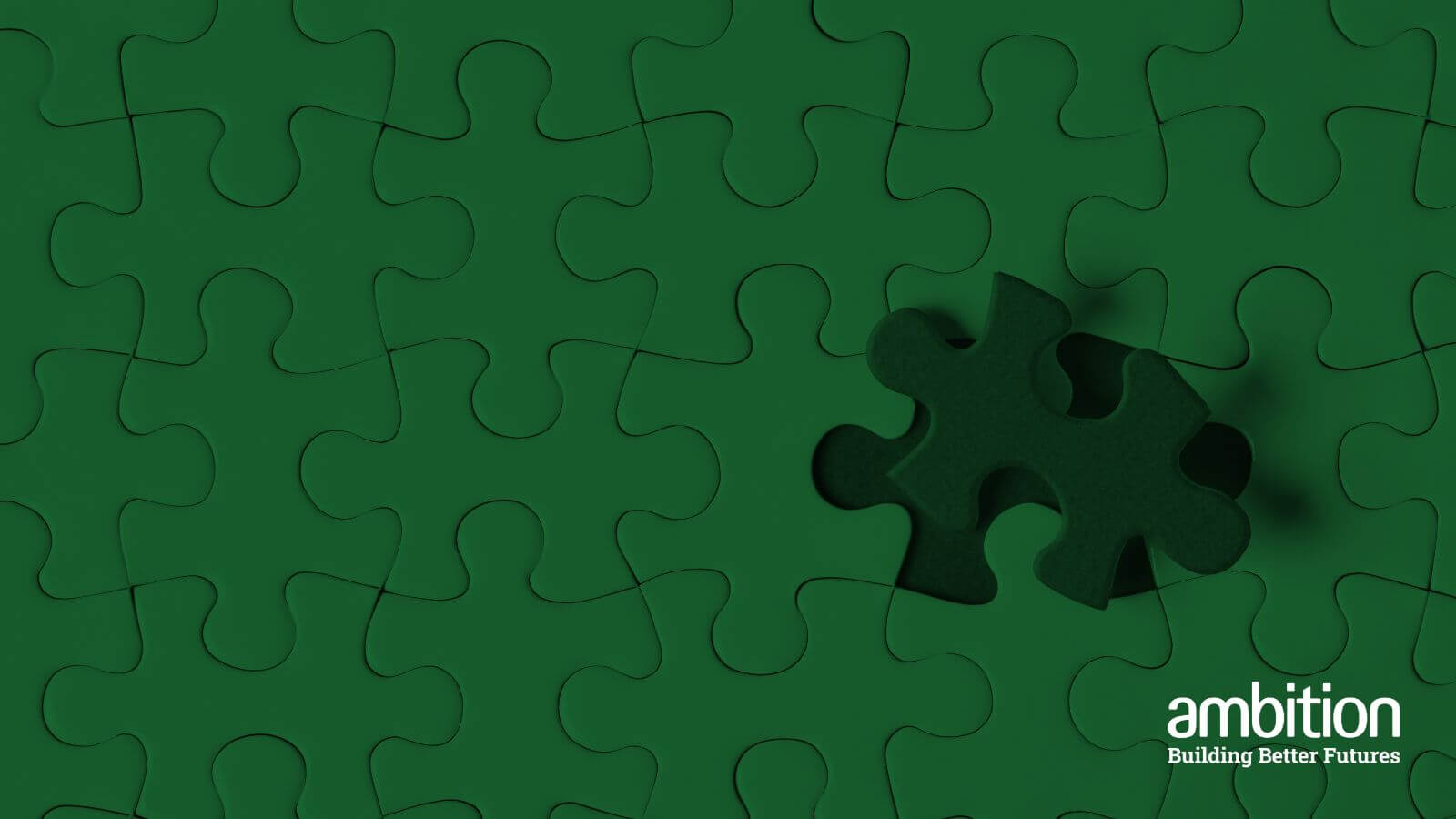 Missing piece of green puzzle being placed.