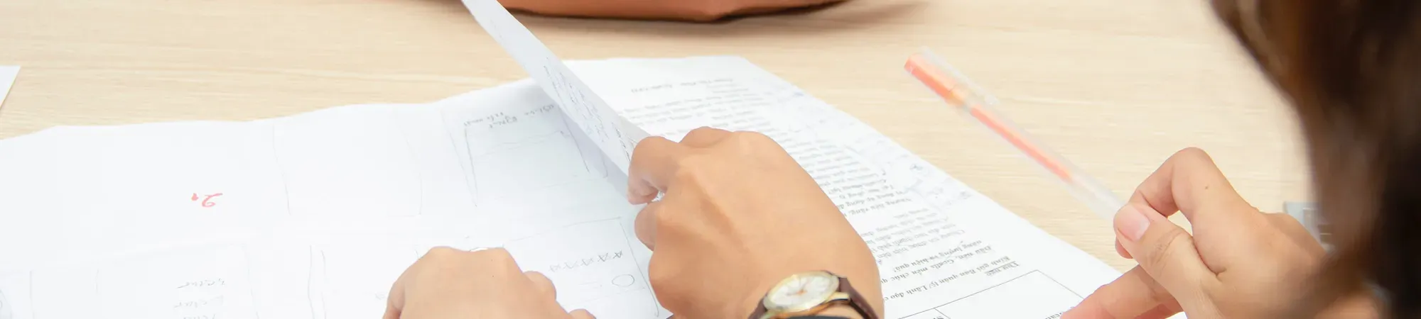 Generic image of people looking at printed documents