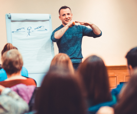 Pat Divilly sharing stories in a workshop