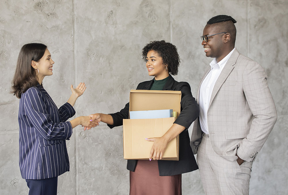 New Employee Lady Holding Box Handshaking With Col 2023 11 27 04 54 26 Utc