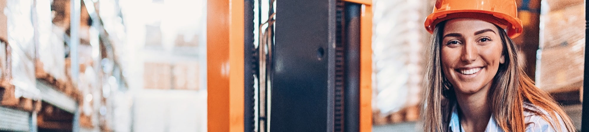 Reach truck in action within a high-rack warehouse setting