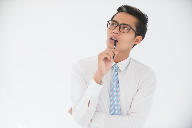 Pensive Asian Business Man Biting Pen Min