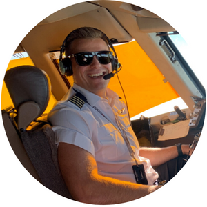 Flight pilot man smiling toward camera