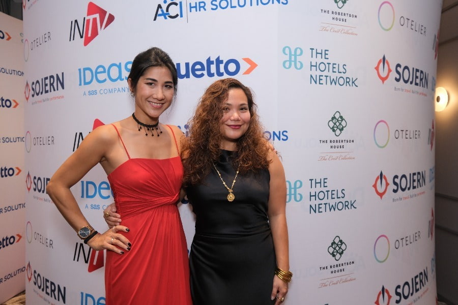 2 women red dress and black dress