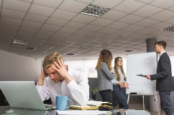 Stressed person at computer