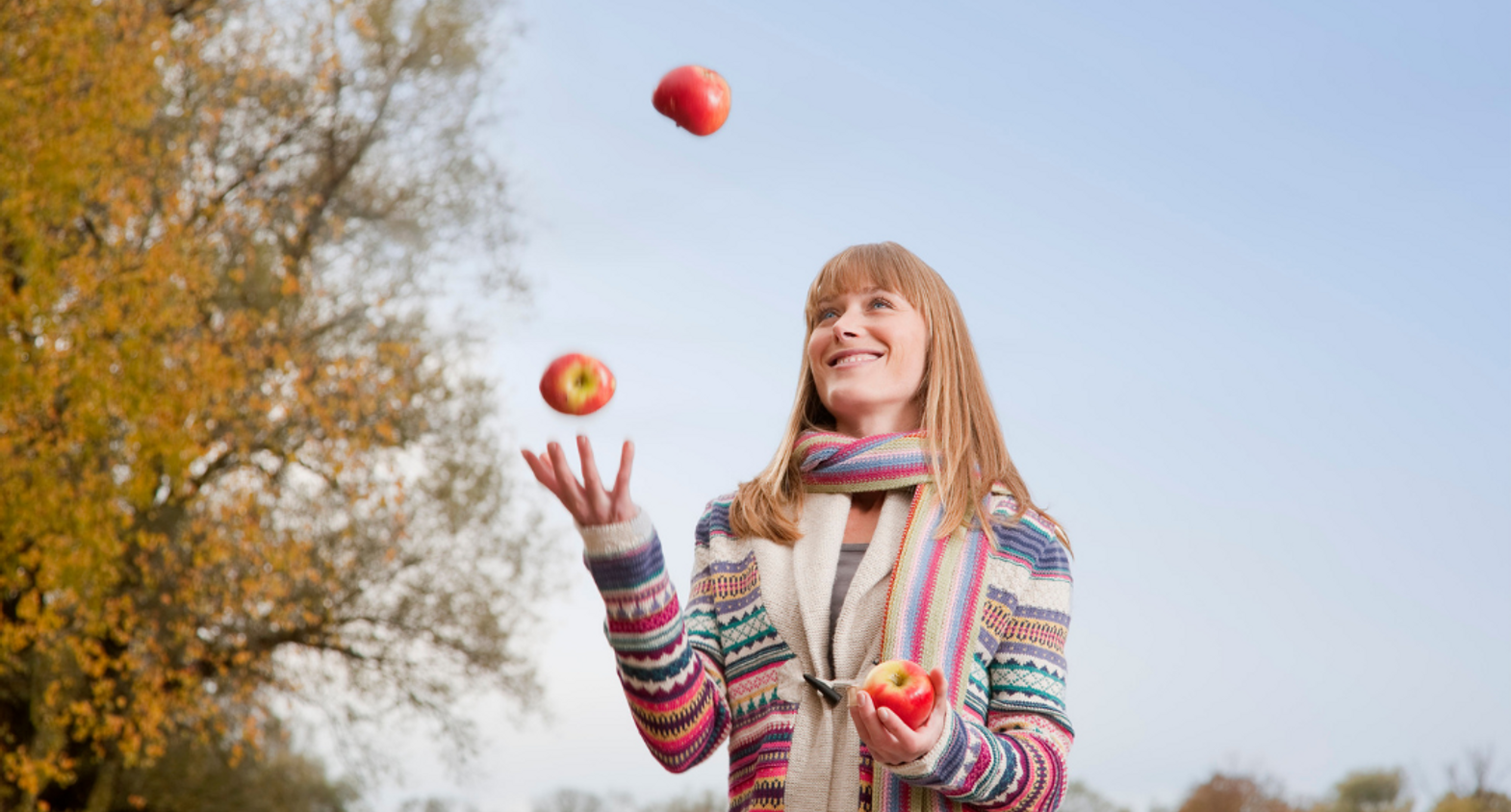 Lady juggling apples