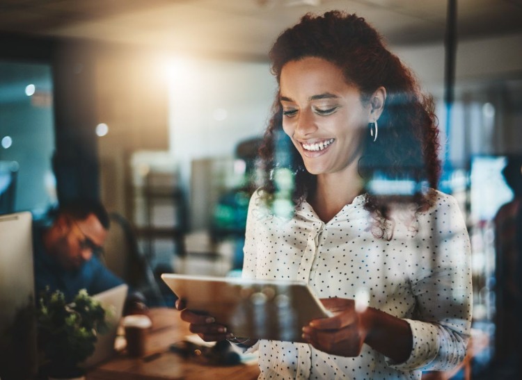 woman using tablet at work
