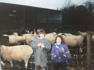 Caroline Macklin and her sister on their family farm when they were kids