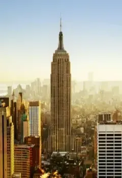 A clear blue sky over New York City, showcasing a vibrant and sunny day.