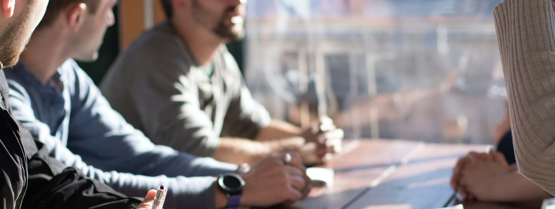 Group of men conversing 