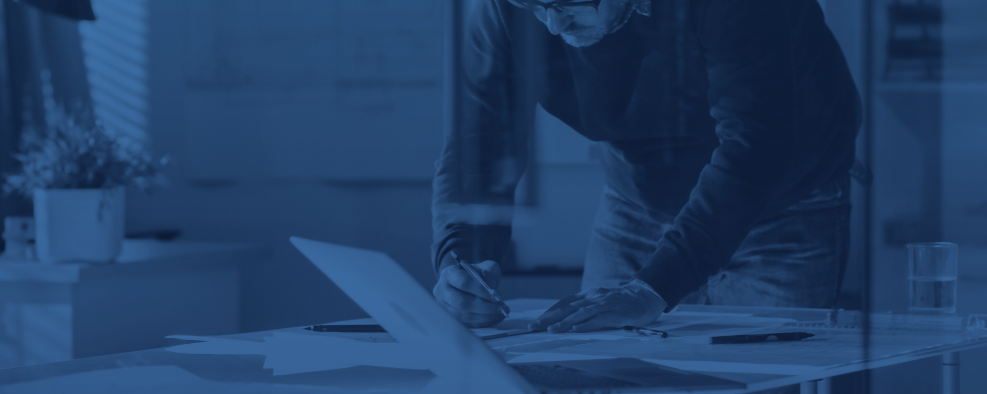 Building services engineer reviewing drawings