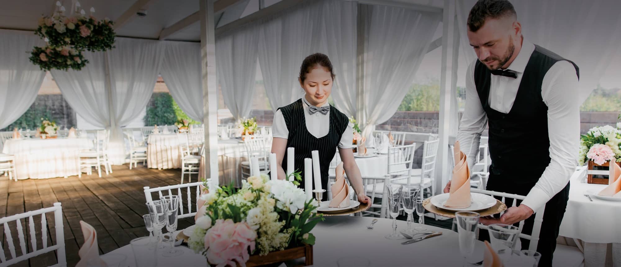 Waiters setting table