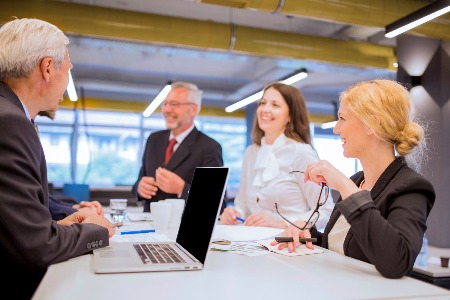 Colleagues talking at work