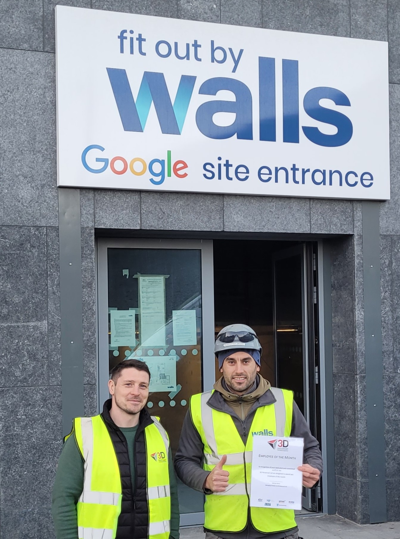 Nicolai receives his award from Brian at the site office