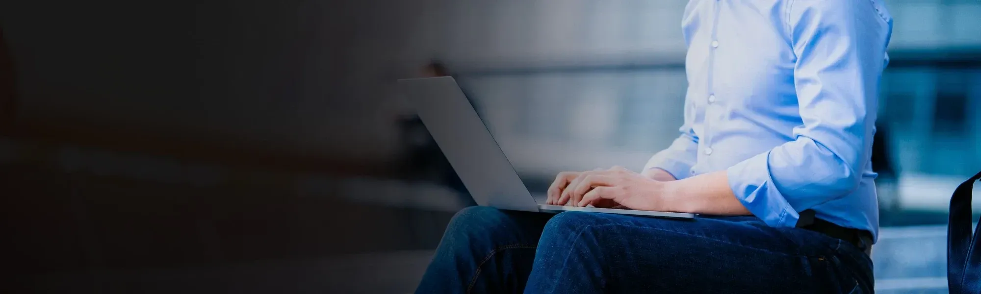 man typing on laptop completing job application for new career