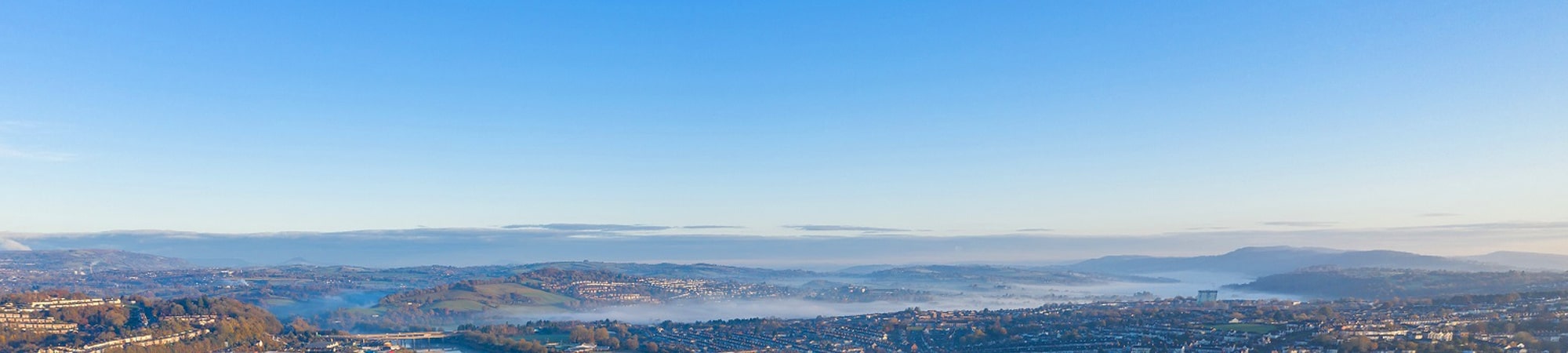 View of UK British city with blue sky roads water highways railway power