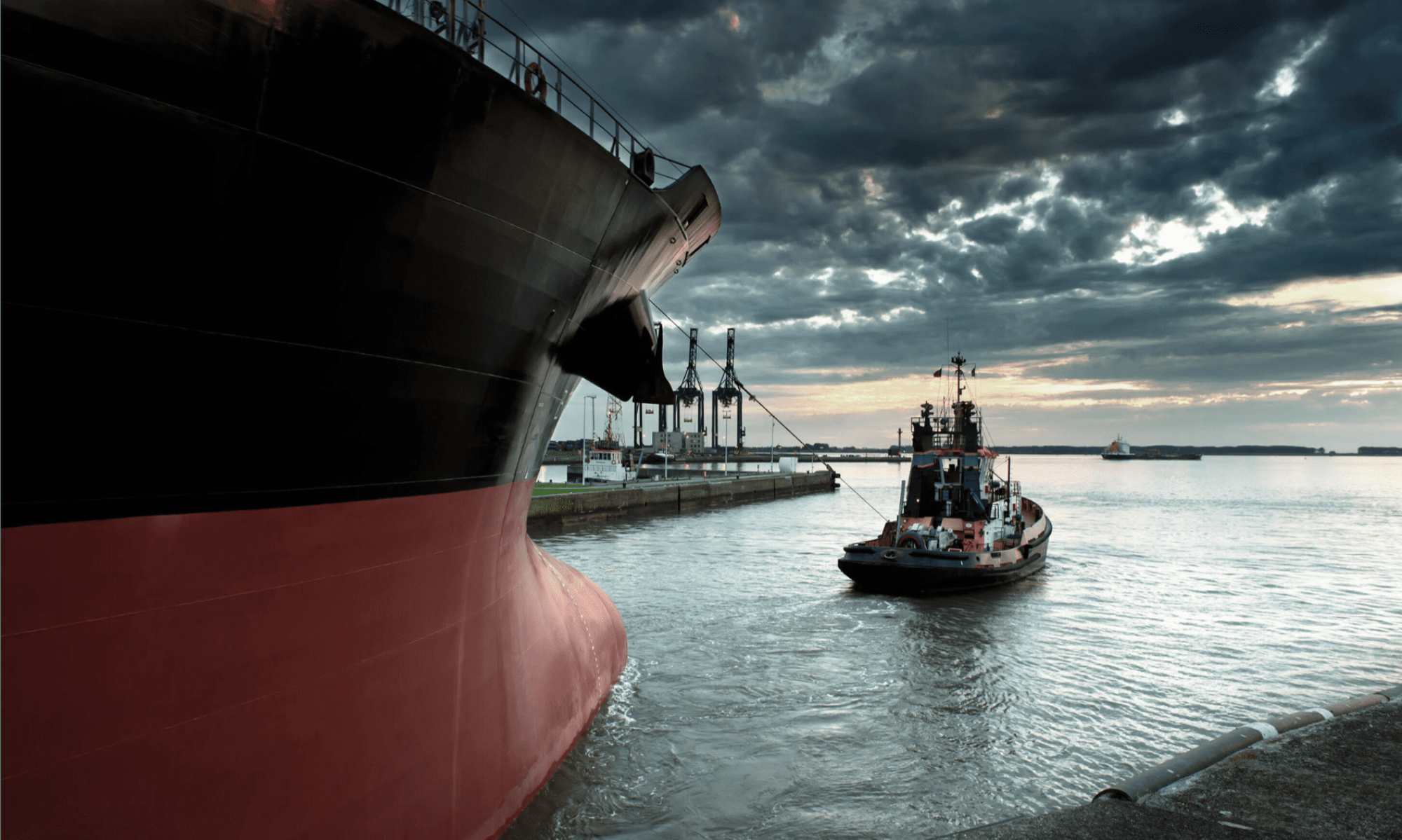 large boat pulling small boat