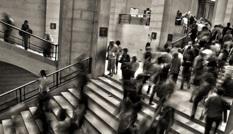 Busy people walking on the stairs.