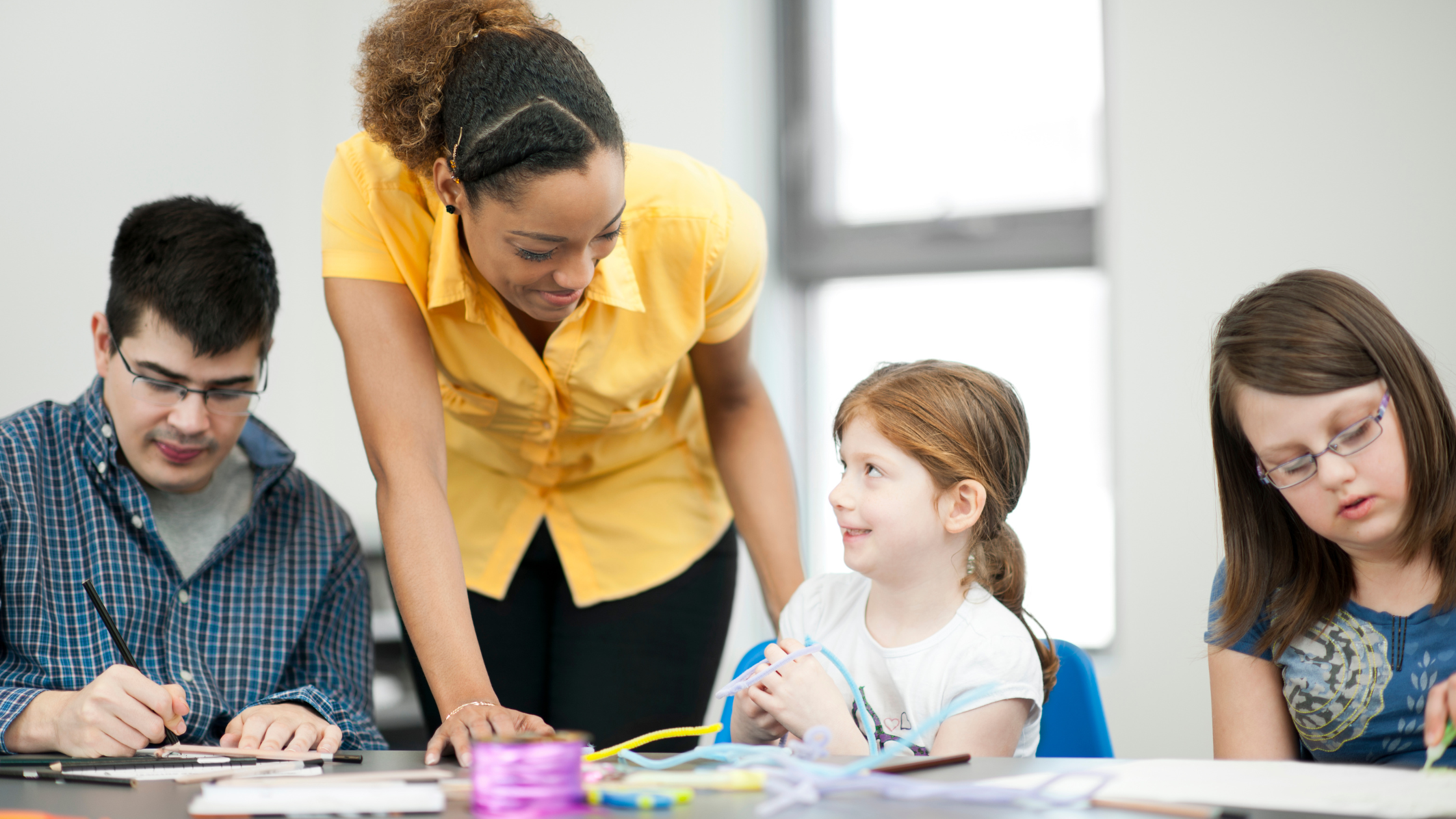 SEND Teacher talking to students - Dunbar Education