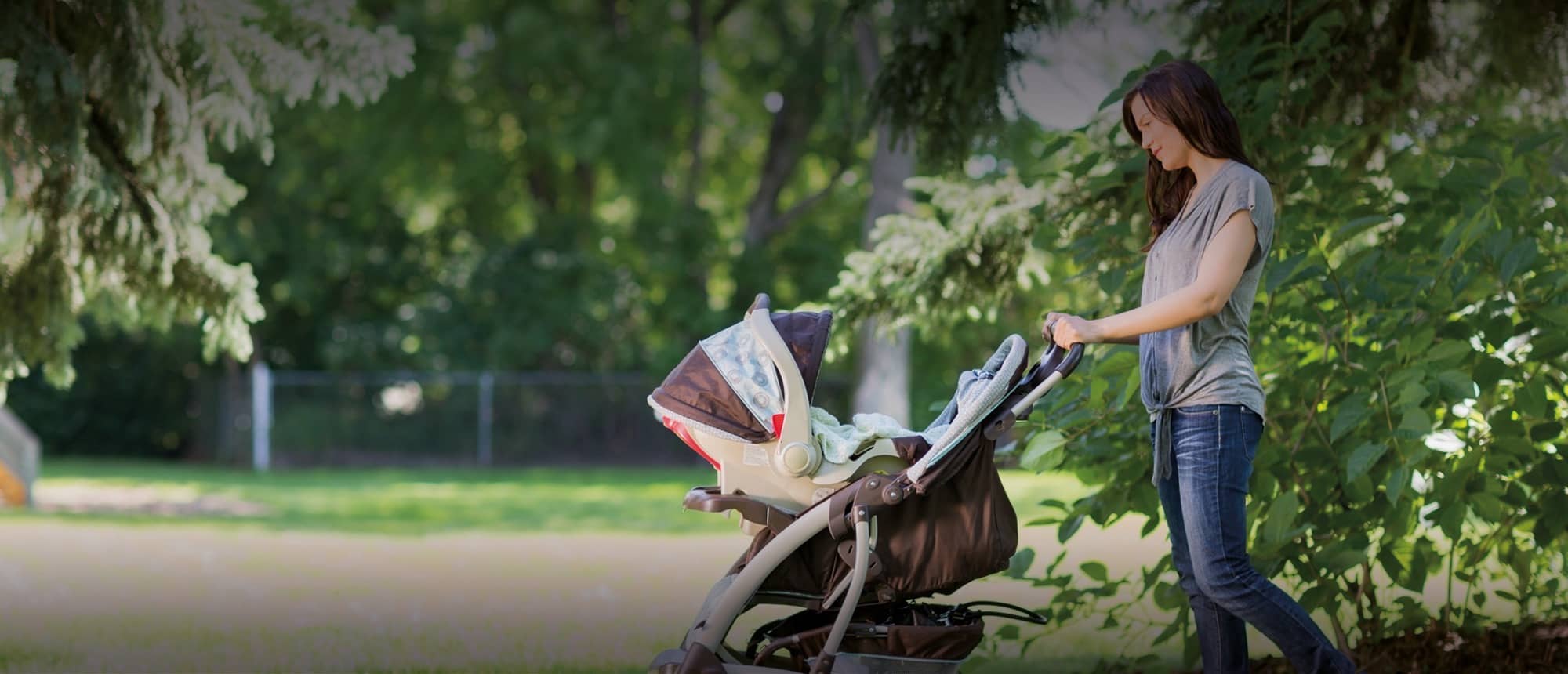 Nanny taking baby for a walk