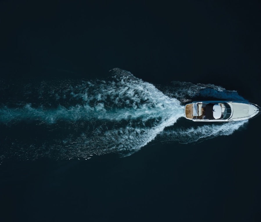 mobile image of workers at a boat factory site