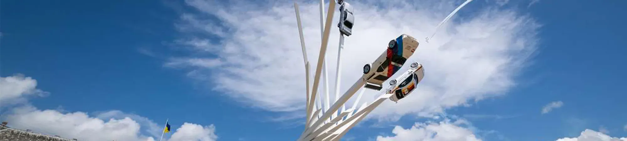Cars on statue at Goodwood Festival of Speed
