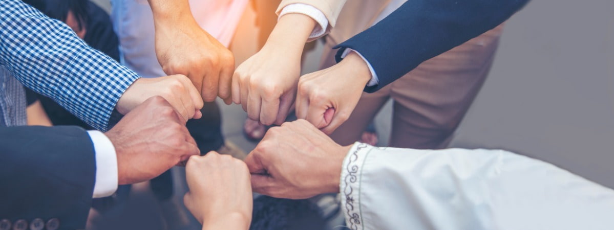 team of people doing a fist bump