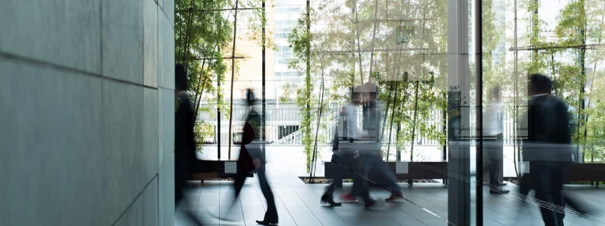 People moving around in a busy work place