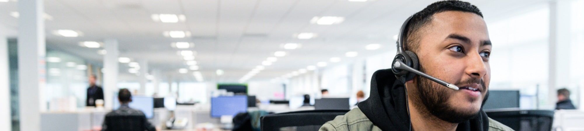 man in call centre with headset