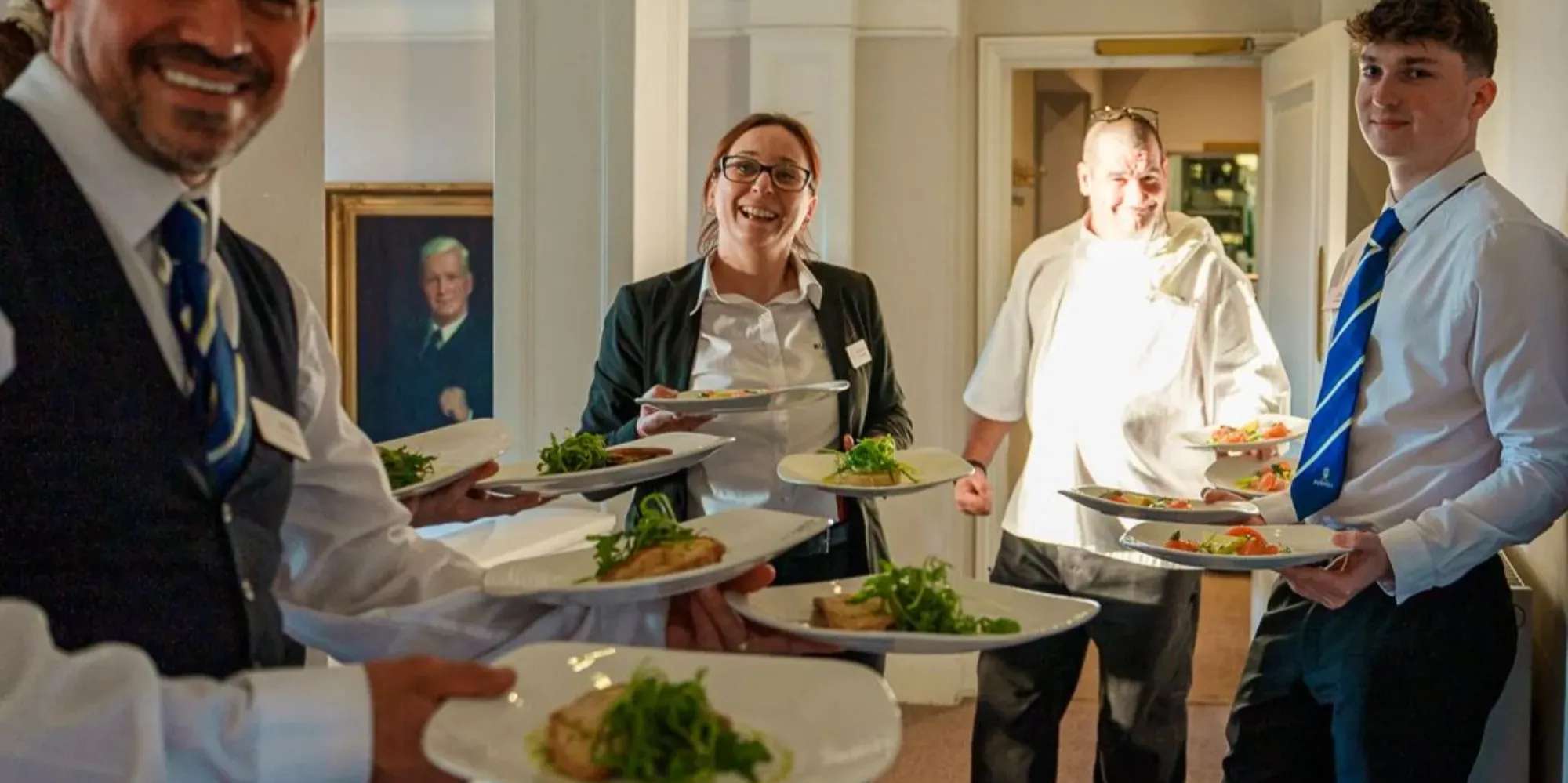staff delivering food smiling