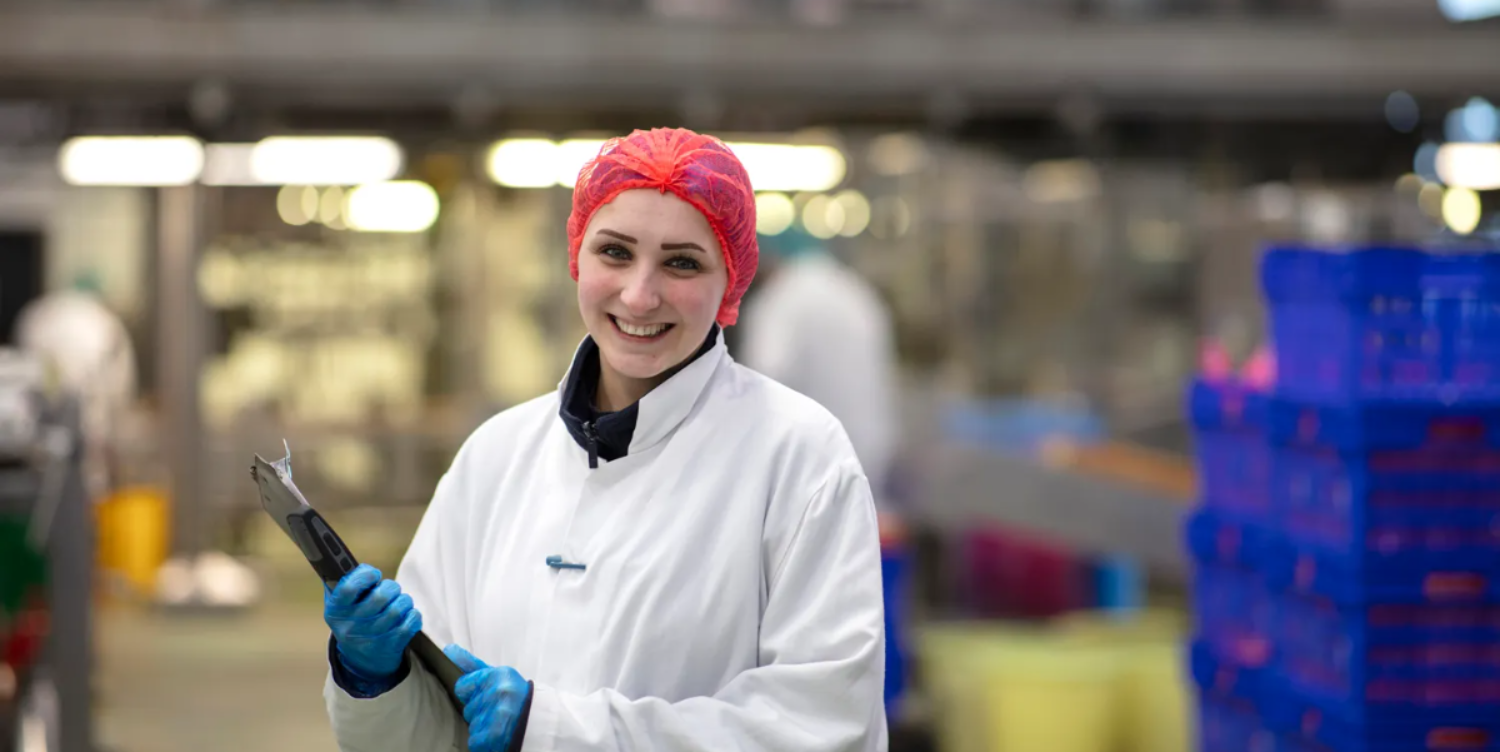 Colleague pouring soup