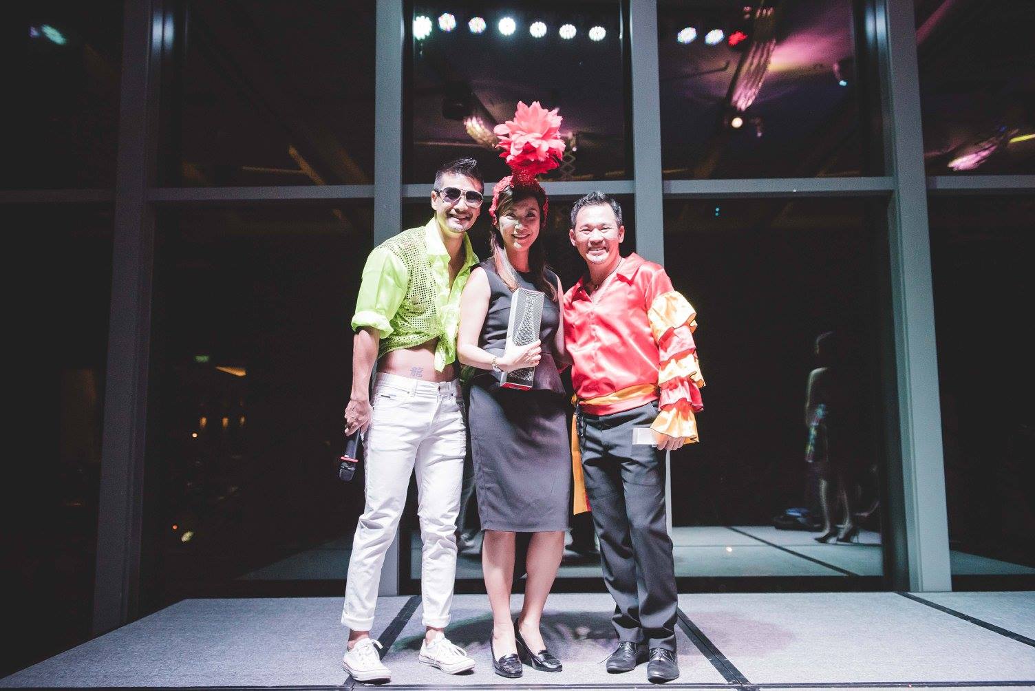 Andrew Chan with two people on stage