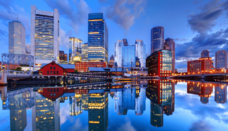 View of high rise buildings along a body of water.