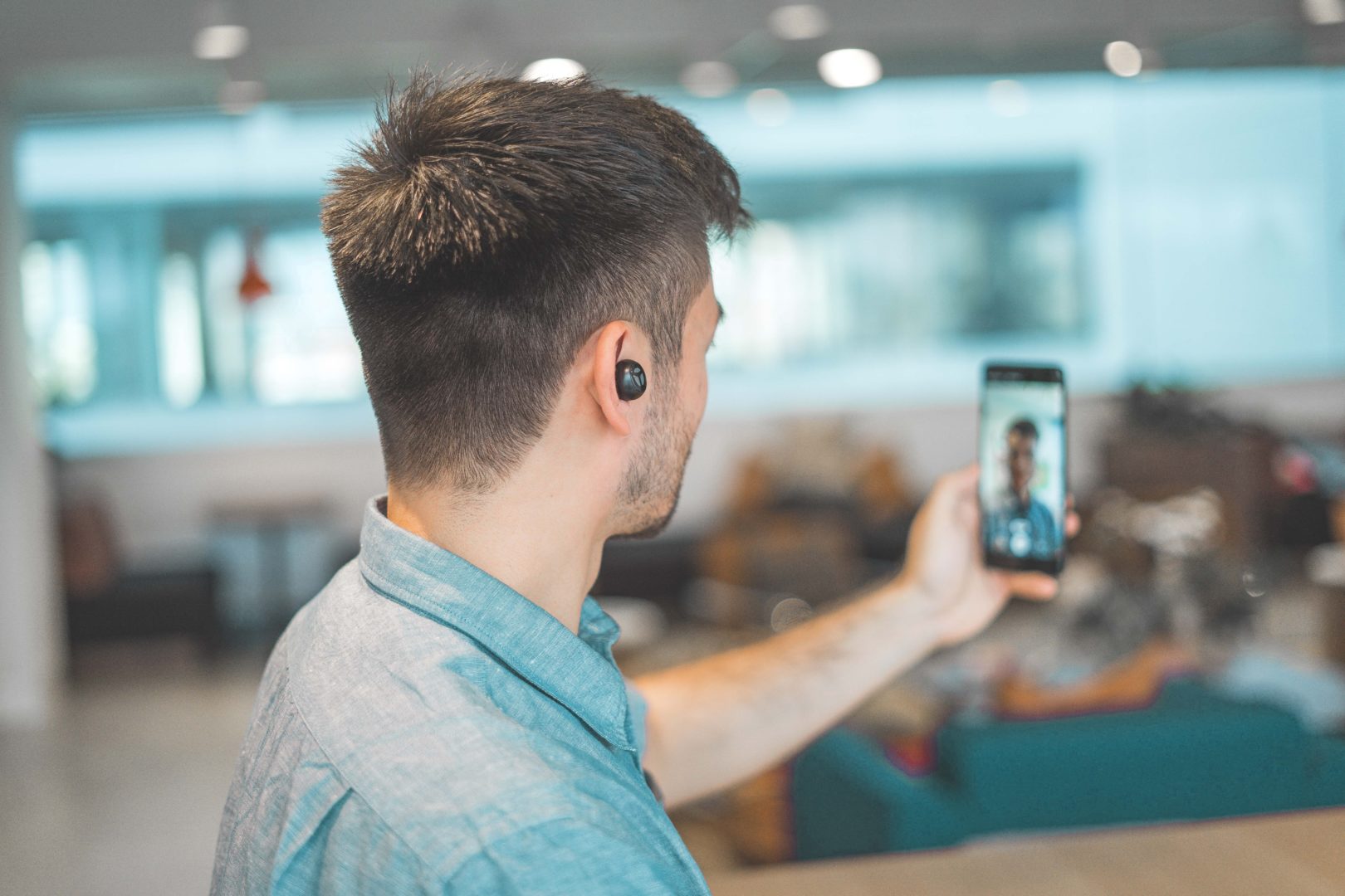 Man at work on video call on mobile