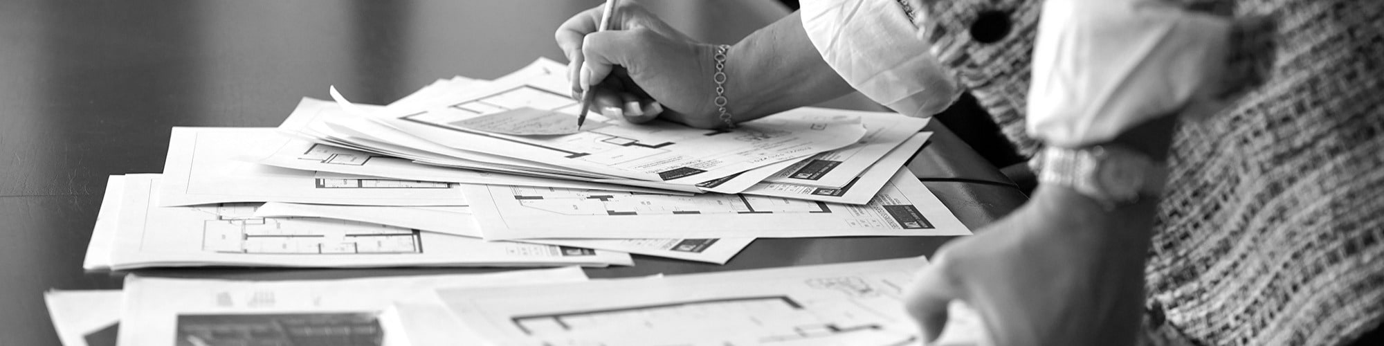 Construction worker signing papers 