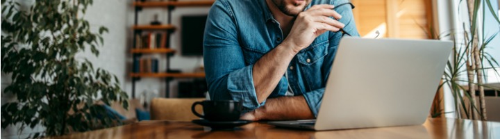 Portrait Of A Casual Entrepreneur Looking At Laptop At Home Office Picture Id1257664287