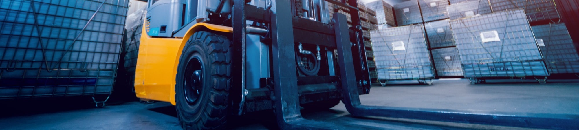 forklift reach truck in rugby warehouse moving pallets 