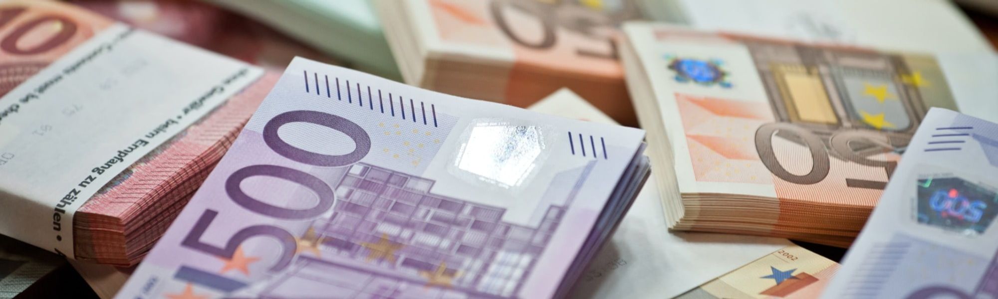 euro notes stacked, typical salaries wages in Ireland Europe