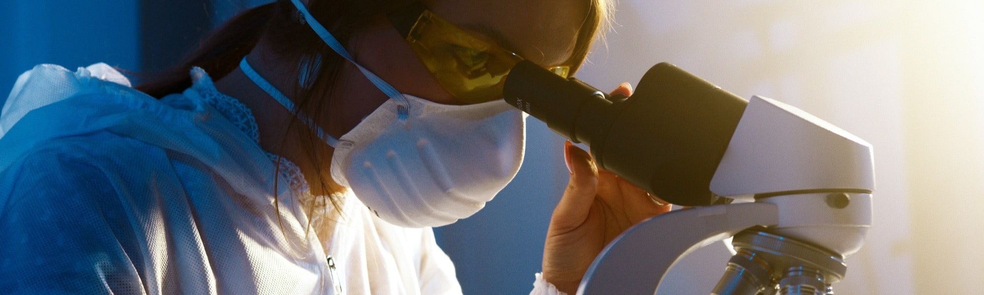 Woman in STEM using microscope