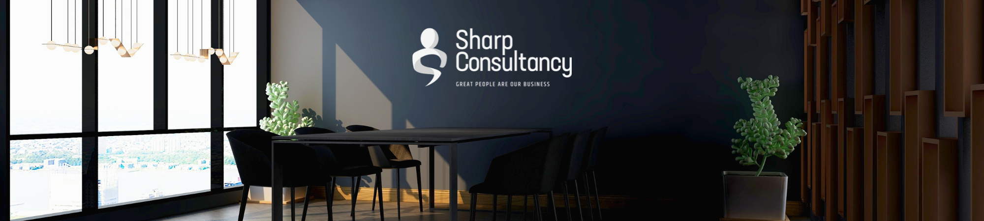 A modern office featuring a sleek black wall and a contemporary table, creating a stylish workspace environment.