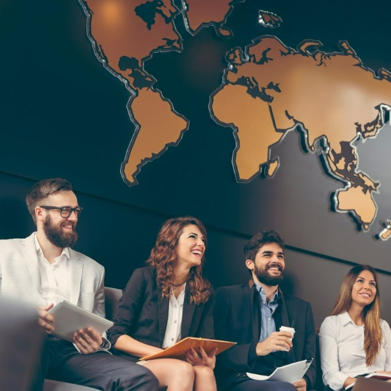 people sitting in a row under a map