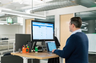 Man on laptop using LinkedIn