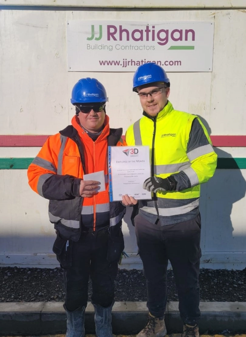 Nathan Mullen from JJ Rhatigan presents Padraig with his award on site in Athlone