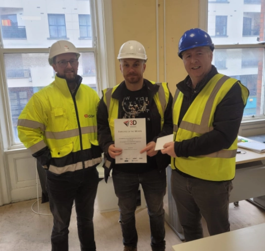 Vlad displays his award alongside Peter (left) and Eamon at the site office