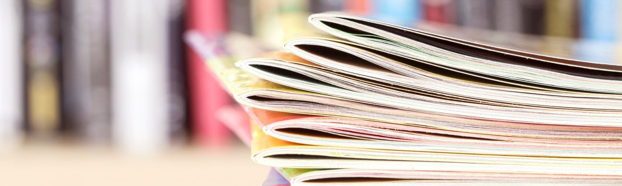 stack of publications, market insights, reports, salary guide, surveys