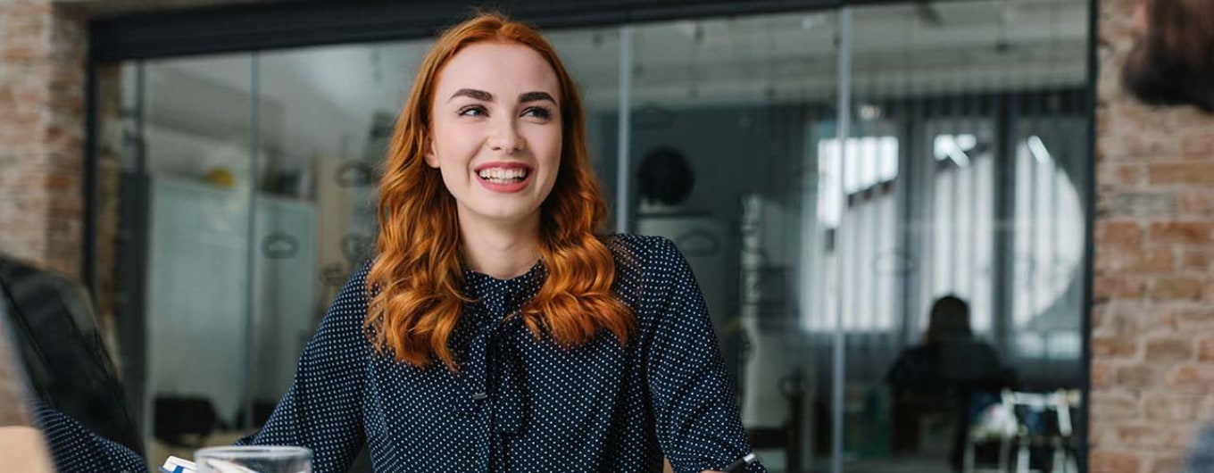 Young lady smiling at an office 